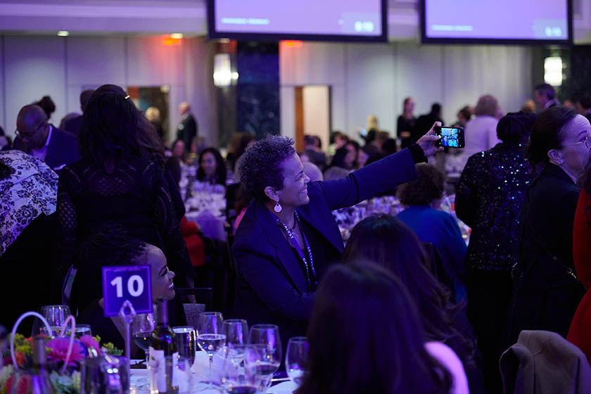 2023 Catalyst Awards attendee taking a selfie at dinner